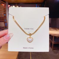 Korean Style Heart Shape Artificial Pearl Titanium Steel Inlaid Gold Pendant Necklace 1 Piece main image 1