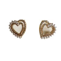 1 Pair Fashion Heart Shape Metal Inlay Artificial Pearls Artificial Diamond Women's Ear Studs main image 2