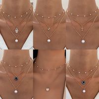 Retro Cross Palm Butterfly Alloy Inlay Artificial Pearls Rhinestones 14k Gold Plated Women's Layered Necklaces main image 1