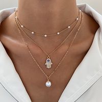 Retro Cross Palm Butterfly Alloy Inlay Artificial Pearls Rhinestones 14k Gold Plated Women's Layered Necklaces main image 6