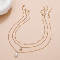 Retro Cross Palm Butterfly Alloy Inlay Artificial Pearls Rhinestones 14k Gold Plated Women's Layered Necklaces main image 3