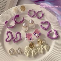 1 Pair Fashion Heart Shape Bow Knot Alloy Stoving Varnish Inlay Pearl Women's Drop Earrings main image 1