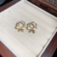 1 Pair Fashion Heart Shape Bow Knot Metal Inlay Artificial Pearls Rhinestones Women's Drop Earrings main image 2