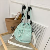 Women's Nylon Solid Color Preppy Style Classic Style Sports Cross Straps Sewing Thread Bucket String Crossbody Bag main image 4