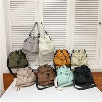 Women's Nylon Solid Color Preppy Style Classic Style Sports Cross Straps Sewing Thread Bucket String Crossbody Bag main image 1