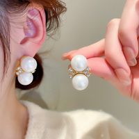Wholesale Jewelry Retro Flower Bow Knot Alloy Pearl Zircon Inlay Ear Studs main image 1