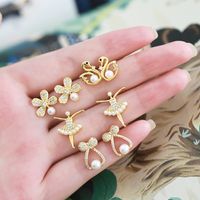 1 Pair Elegant Simple Style Flower Bow Knot Plating Inlay Copper Artificial Pearls Zircon 18k Gold Plated Ear Studs main image 1