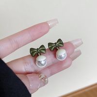 1 Pair Elegant Bow Knot Plating Inlay Alloy Artificial Pearls Drop Earrings main image 1