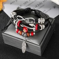 Casual Handmade Feather Pu Leather Alloy Wooden Beads Beaded Knitting Men's Drawstring Bracelets main image 1