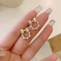 1 Pair Simple Style Bow Knot Plating Inlay Alloy Artificial Rhinestones Artificial Pearls Gold Plated Ear Studs main image 7