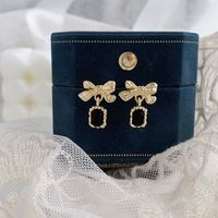 1 Pair Elegant Lady Bow Knot Inlay Alloy Artificial Rhinestones Gold Plated Drop Earrings main image 7