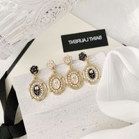 1 Pair Simple Style Classic Style Color Block Plating Inlay Alloy Artificial Pearls Gold Plated Drop Earrings main image 3