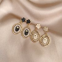 1 Pair Simple Style Classic Style Color Block Plating Inlay Alloy Artificial Pearls Gold Plated Drop Earrings main image 1