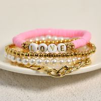 Casual Vacation Letter Artificial Pearl Alloy Soft Clay Beaded Gold Plated Women's Bracelets main image 1