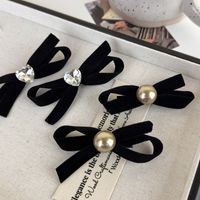 Women's Simple Style Commute Bow Knot Cloth Inlay Pearl Hair Clip main image 1