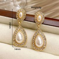1 Pair Ig Style Simple Style Water Droplets Plating Inlay Alloy Acrylic Rhinestones Pearl Gold Plated Drop Earrings Ear Cuffs sku image 1