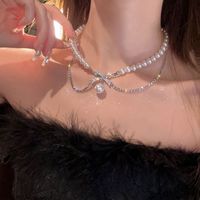 Großhandel Einfacher Stil Pendeln Bogenknoten Perlmutt Titan Stahl Perlen Geschichtete Halskette main image 3