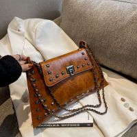 Women's Pu Leather Solid Color Streetwear Rivet Square Lock Clasp Shoulder Bag main image 9