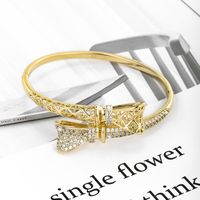 Xuping Shiny Bow Knot Alloy Plating Inlay Artificial Gemstones 14k Gold Plated Women's Bangle main image 1