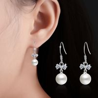 1 Pair Elegant Bow Knot Plating Inlay Copper Artificial Pearls Zircon White Gold Plated Drop Earrings main image 1