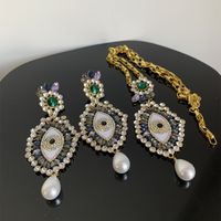 Retro Baroque Style Eye Alloy Pearl Plating Inlay Acrylic Rhinestones Gold Plated Women's Earrings Necklace main image 5
