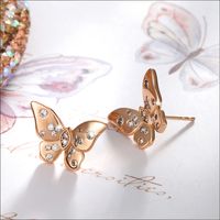 1 Pair Vintage Style Xuping Roman Style Rabbit Solar System Butterfly Asymmetrical Plating Inlay Copper Alloy Artificial Diamond 18k Gold Plated White Gold Plated Ear Studs main image 6