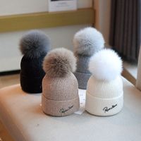 Women's Sweet Simple Style Solid Color Pom Poms Eaveless Wool Cap main image 1