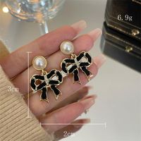 1 Pair Simple Style Square Heart Shape Bow Knot Enamel Plating Inlay Alloy Artificial Gemstones Artificial Pearls Rhinestones 14k Gold Plated Drop Earrings Ear Studs main image 3