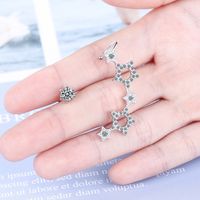 1 Pair Simple Style Shiny Star Asymmetrical Hollow Out Inlay Copper Zircon Ear Studs main image 3
