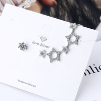 1 Pair Simple Style Shiny Star Asymmetrical Hollow Out Inlay Copper Zircon Ear Studs main image 4