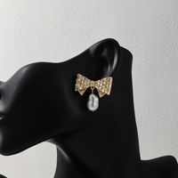 1 Pair Glam Bow Knot Plating Inlay Alloy Artificial Pearls Rhinestones Drop Earrings main image 1