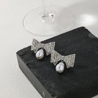 1 Pair Glam Bow Knot Plating Inlay Alloy Artificial Pearls Rhinestones Drop Earrings main image 5