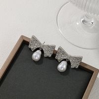 1 Pair Glam Bow Knot Plating Inlay Alloy Artificial Pearls Rhinestones Drop Earrings main image 7