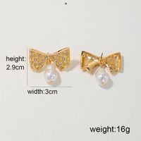 1 Pair Glam Bow Knot Plating Inlay Alloy Artificial Pearls Rhinestones Drop Earrings main image 2