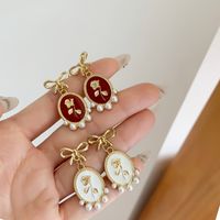 1 Pair Vintage Style Bow Knot Enamel Plating Inlay Alloy Artificial Pearls Gold Plated Drop Earrings main image 4