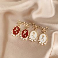 1 Pair Vintage Style Bow Knot Enamel Plating Inlay Alloy Artificial Pearls Gold Plated Drop Earrings main image 1