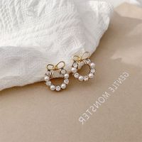 1 Pair Simple Style Classic Style Bow Knot Plating Inlay Alloy Artificial Rhinestones Artificial Pearls Gold Plated Ear Studs main image 4