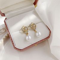 1 Pair Elegant Korean Style Flower Inlay Imitation Pearl Alloy Artificial Rhinestones Gold Plated Drop Earrings main image 5