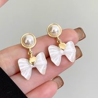 1 Pair Elegant Korean Style Bow Knot Inlay Alloy Artificial Pearls Drop Earrings sku image 1