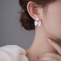 1 Paire Élégant Style Coréen Noeud D'arc Incruster Alliage Perles Artificielles Boucles D'oreilles main image 5