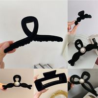 Simple Style Bow Knot Twist Imitation Pearl Cloth Hair Claws main image 2