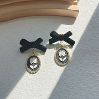 1 Pair Retro Classic Style Flower Bow Knot Plating Imitation Pearl Alloy 14k Gold Plated Drop Earrings main image 6