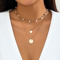 Simple Style Classic Style Irregular Round Imitation Pearl Copper Layered Tassel Layered Necklaces main image 1