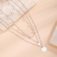 Simple Style Classic Style Irregular Round Imitation Pearl Copper Layered Tassel Layered Necklaces main image 4