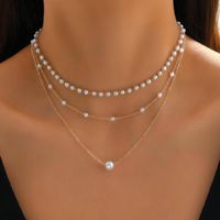 Simple Style Geometric Artificial Pearl Alloy Plating Women's Three Layer Necklace main image 1