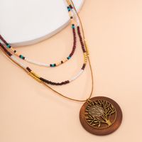 Chinoiserie Retro Vacation Round Tree Leaves Alloy Wood Board Seed Bead Irregular Beaded Tassel Women's Layered Necklaces main image 4
