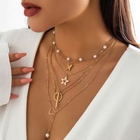 French Style Sweet Classic Style Star Heart Shape Butterfly Imitation Pearl Alloy Copper Women's Necklace main image 5