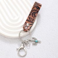 Simple Style Cactus Leaf Dreamcatcher Pu Leather Alloy Turquoise Bag Pendant Keychain main image 4