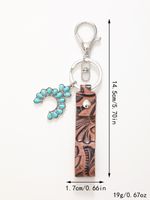 Simple Style Cactus Leaf Dreamcatcher Pu Leather Alloy Turquoise Bag Pendant Keychain main image 2