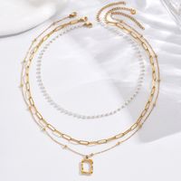 304 Stainless Steel 14K Gold Plated Elegant Simple Style Roman Style Pearl Plating Inlay Triangle Square Roman Numeral Acrylic Three Layer Necklace main image 3